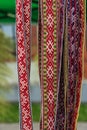 Weaving bacground. Ragged international belts. Woven belts Royalty Free Stock Photo