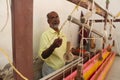 Weaving or Handloom Industry in India. Textile handicraft artisans. Spinning Cotton into thread.