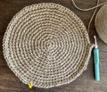 A jute table mat; round placemat on the wooden table