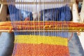 Weaving loom with knitted throw. Vintage wooden loom handmade