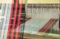 Weaving loom and shuttle on the warp Royalty Free Stock Photo