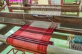 Weaving loom and shuttle on the warp Royalty Free Stock Photo