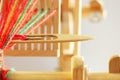 Weaving mini machine for making belts with patterns. Folk art, handmade. Detail. Royalty Free Stock Photo