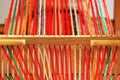 Weaving mini machine for making belts with patterns. Folk art, handmade. Detail.