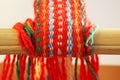 Weaving mini machine for making belts with patterns. Folk art, handmade. Detail.
