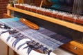 Weaving shuttle on the blue warp in weaving machine