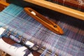 Weaving shuttle on the blue warp in weaving machine