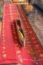 Weaving shuttle on loom with traditional Thai silk Royalty Free Stock Photo