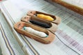 Weaving shuttle, Weaving loom and shuttle on the warp Royalty Free Stock Photo