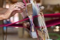 Weaving. Woman hand weaving on manual loom. Fabric handmade. Homespun fabric process. The process of fabric weaving in vintage