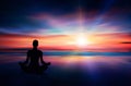 Yoga woman silhouette meditating at sunset colorful sky Royalty Free Stock Photo