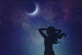 Young woman reaching for the moon Royalty Free Stock Photo