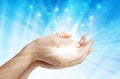Hands with spark of hope, the light of faith background