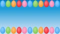Colourful easter eggs frame on blue surface background Royalty Free Stock Photo
