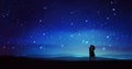 Couple silhouettes under meteor shower, night sky with stars