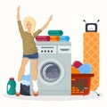 Happy woman next to laundry equipment. Working washing machine with linen baskets, detergent, ironing board and towels Royalty Free Stock Photo