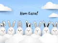 Happy Easter funny cute rabbits with calligraphic text and easter eggs on light blue background