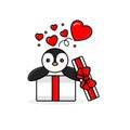 Happy penguin inside the open gift box with fly hearts. Royalty Free Stock Photo