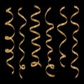 Gold curling ribbons or party serpentine isolated on black background.