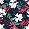 Summer trend seamless pattern with tropical leaves and plants on a dark background. Vector design. Jung print. Floral background. Royalty Free Stock Photo