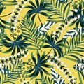 Summer bright original seamless pattern with tropical leaves and plants on a yellow background. Vector design. Jung print. Floral Royalty Free Stock Photo