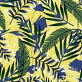 Bright summer seamless pattern with tropical leaves and flowers on a pastel background. Vector design. Jung print. Floral backgrou