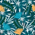 Summer trend seamless pattern with bright tropical leaves, plants and flowers on a dark blue background. Vector design. Jung print