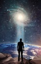 Man Looks Out At Earth From Space, destiny, nebula, light beam Spiritual love healing earth energy, power, portal, evolution Royalty Free Stock Photo