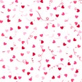Seamless pattern with colorful confetti hearts and serpentine.