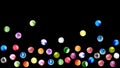 Selection of colourful marbles on black background