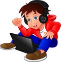 Little boy sitting on the floor using a laptop and listened to music Royalty Free Stock Photo