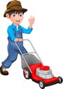 Happy  boy is mowing the lawn with the lawn mower Royalty Free Stock Photo