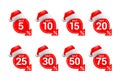 Christmas or New Year sale tags with Santa hat Royalty Free Stock Photo