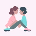 Cute lesbian couple sitting close to each other and about to kiss.