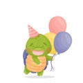 A cute cartoon green turtle smiling. There is a red festive hat on his head, holding multi-colored balloons in his hands.
