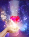 Cosmic love, universal diamond heart in hands with spark of hope, the light of faith Royalty Free Stock Photo