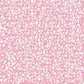 abstract simple seamless pattern many small dots spots on a contrasting background. Leopard background pink and white Royalty Free Stock Photo