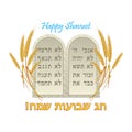 Stone tablets with the Ten Commandments of God in Hebrew, ears of wheat, Hebrew text, translated as `Happy Shavuot`. Royalty Free Stock Photo