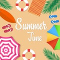 It`s summer time. Beach background top view with umbrellas, swimming ring, surfboard, sandals. Royalty Free Stock Photo