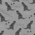 Dino pattern. Grunge dinosaurs, text and footprints.