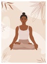 African American woman sits in lotus pose