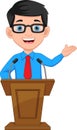 Young businessman giving a speech at the podium Royalty Free Stock Photo