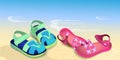 Bright children\'s sandals on a sandy beach Royalty Free Stock Photo