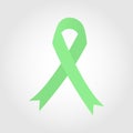 A light green ribbon is used to raise awareness for sexually transmitted diseases Royalty Free Stock Photo