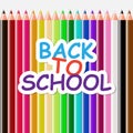 Color text `Back to school` on the background of a set of colored pencils. Royalty Free Stock Photo