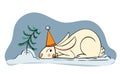 A cute rabbit in a festive hat hides behind a Christmas tree