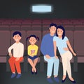 Happy family in the cinema watching a movie.