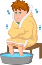 Boy cold with feet soaking in warm water Royalty Free Stock Photo