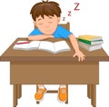 Tired schoolboy sleep at the table during Studying