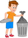 boy throws garbage in the garbage bin